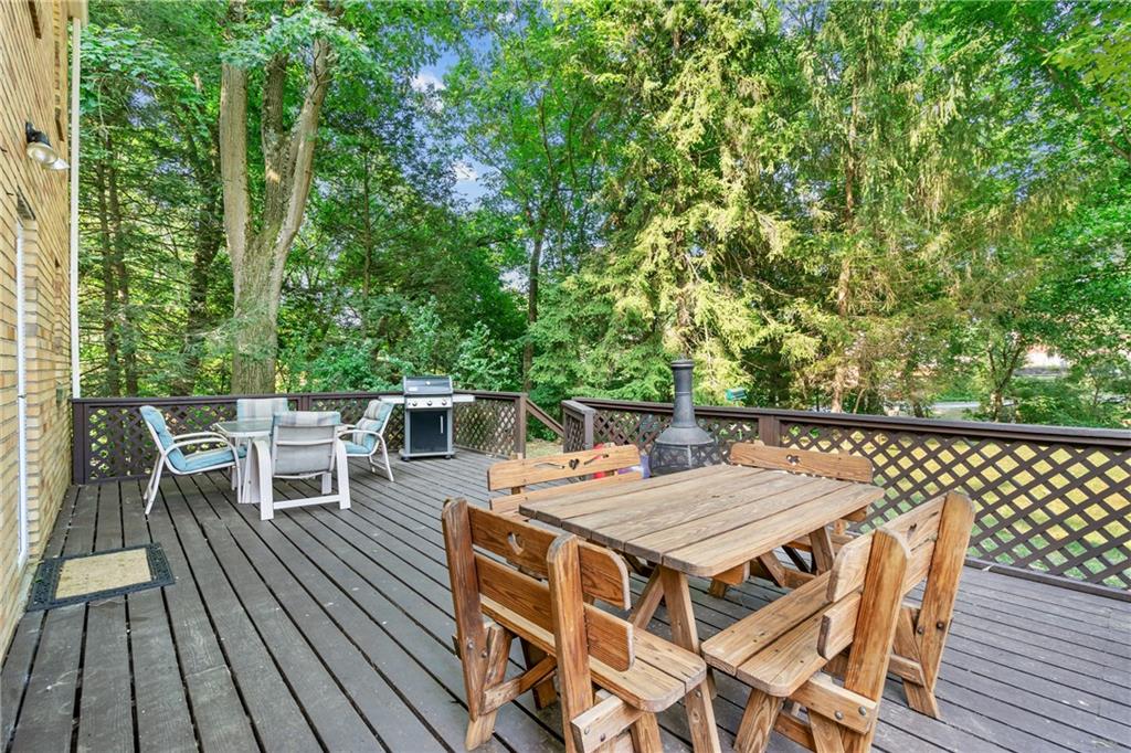 1031 Anderson Road Pittsburgh, PA 15209 - Photo 24 of 35 a roof deck with a table and chairs