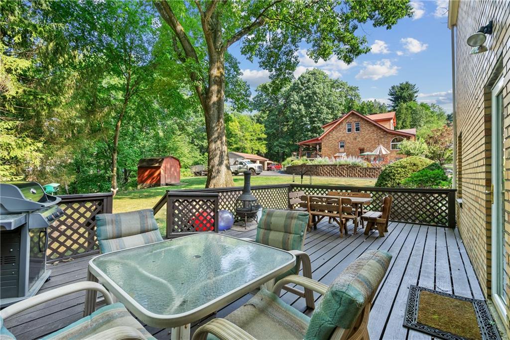 1031 Anderson Road Pittsburgh, PA 15209 - Photo 26 of 35 an outdoor sitting area with furniture and wooden floor