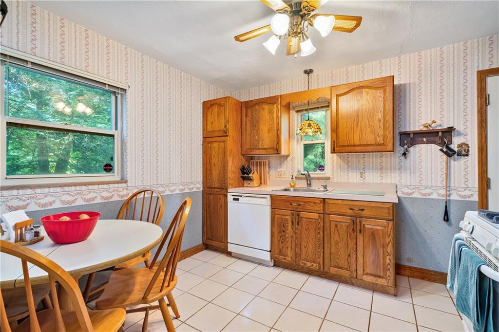 1031 Anderson Road Pittsburgh, PA 15209 - Photo 5 of 35 a kitchen with a table chairs sink and cabinets