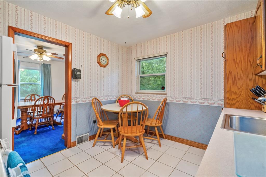 1031 Anderson Road Pittsburgh, PA 15209 - Photo 7 of 35 a view of a dining room with furniture and wooden floor