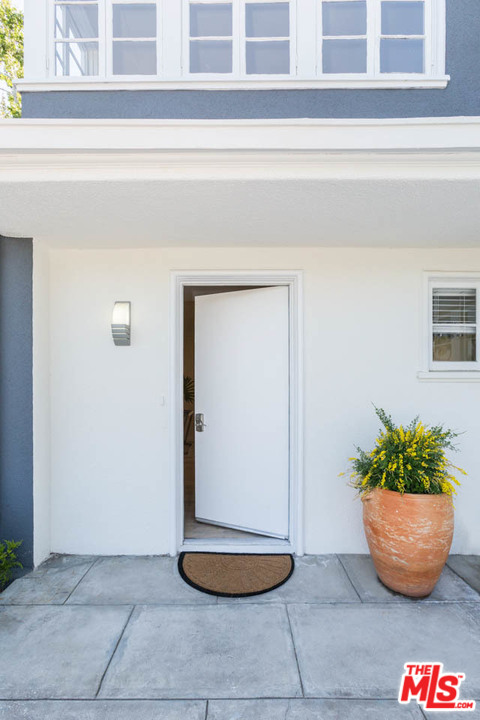 5 Richland Place Pasadena, CA 91103 - Photo 3 of 54 a view of a potted plant sitting in front of a door