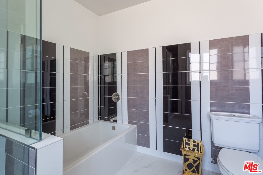 5 Richland Place Pasadena, CA 91103 - Photo 36 of 54 a bathroom with a bathtub and a shower