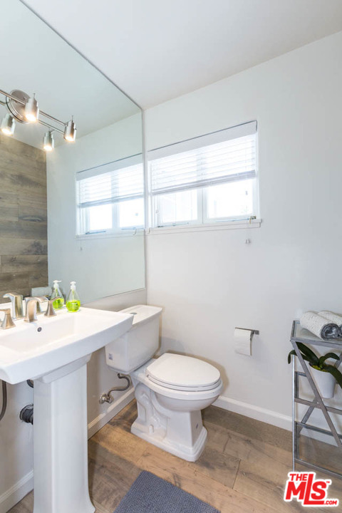 5 Richland Place Pasadena, CA 91103 - Photo 5 of 54 a bathroom with a sink mirror vanity and toilet