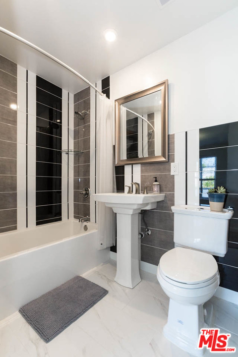 5 Richland Place Pasadena, CA 91103 - Photo 42 of 54 a bathroom with a toilet a sink and mirror