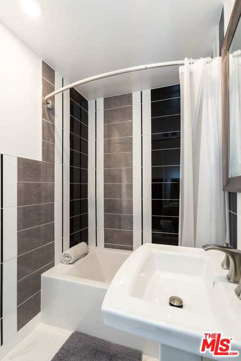 5 Richland Place Pasadena, CA 91103 - Photo 43 of 54 a bathroom with a bathtub and shower