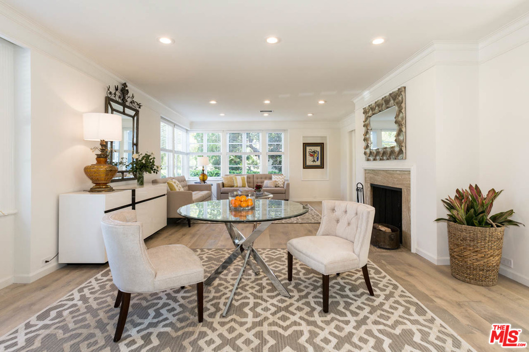 5 Richland Place Pasadena, CA 91103 - Photo 6 of 54 a living room with furniture a fireplace and a table
