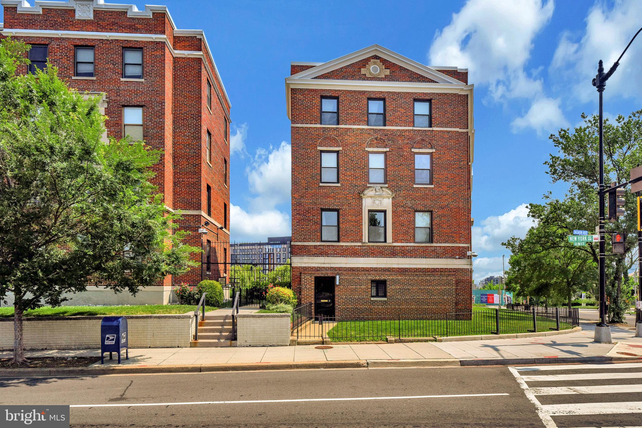 80 New York Avenue Northwest, Unit 303 Washington, DC 20001 - Photo 2 of 27 a view of a brick building next to a yard