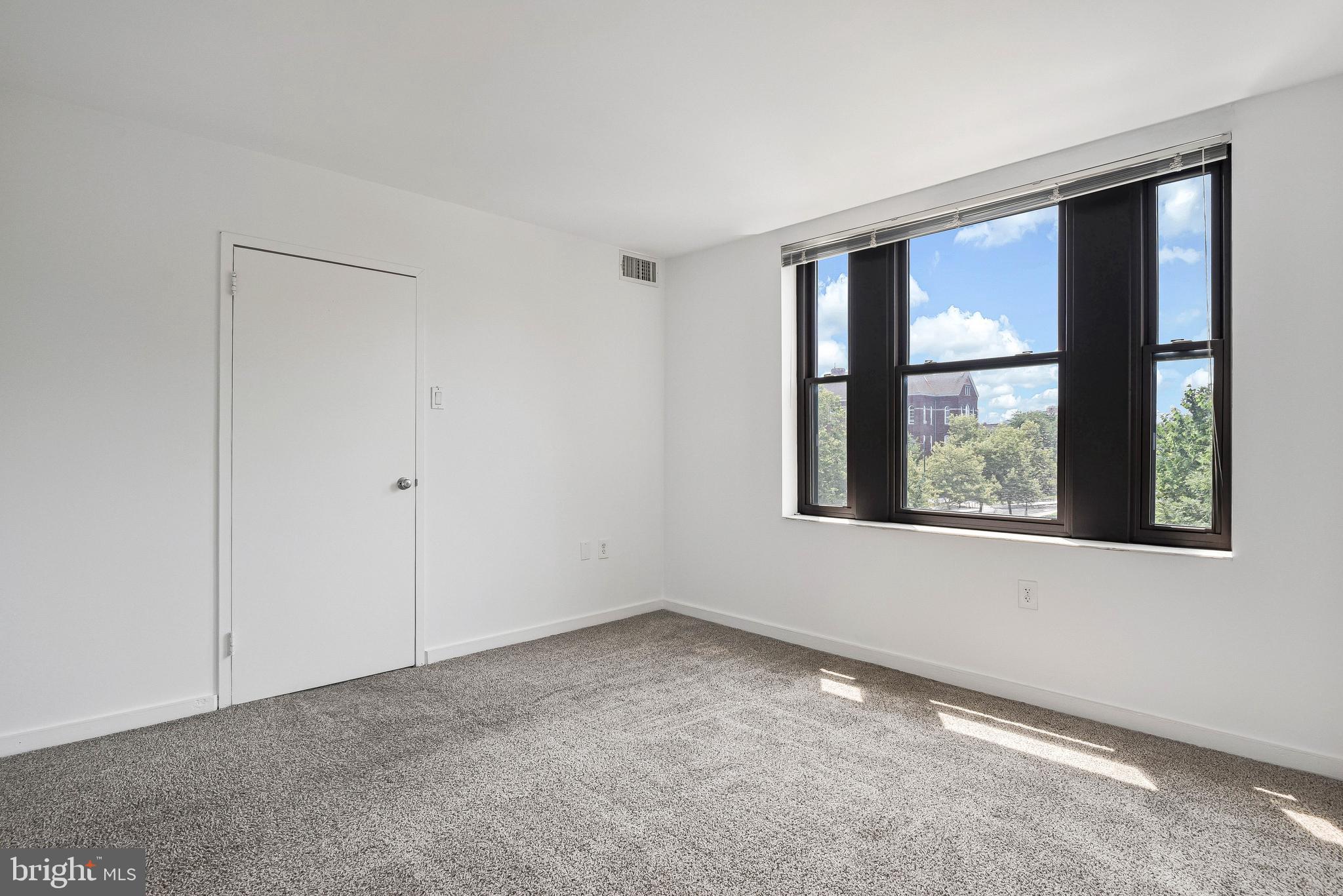 80 New York Avenue Northwest, Unit 303 Washington, DC 20001 - Photo 23 of 27 a view of an empty room with a window