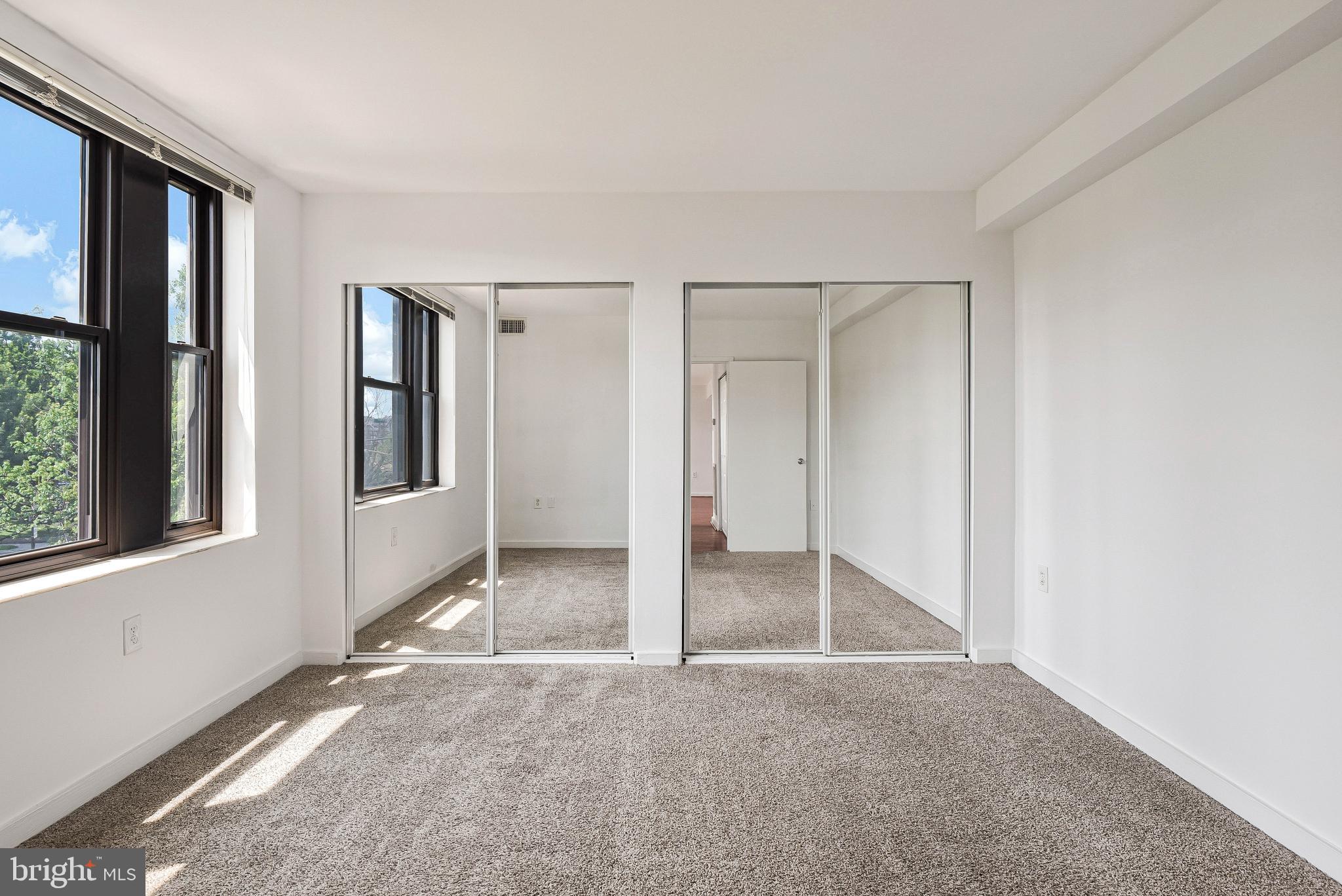 80 New York Avenue Northwest, Unit 303 Washington, DC 20001 - Photo 24 of 27 an empty room with windows