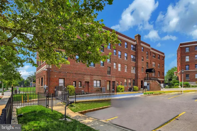 a front view of a building with garden