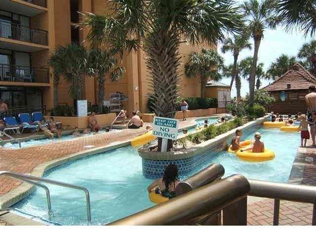 6900 North Ocean Boulevard, Unit 611 Myrtle Beach, SC 29572 - Photo 11 of 17 Community pool with a patio area