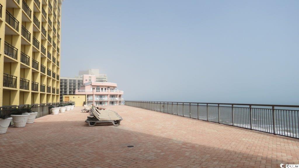 6900 North Ocean Boulevard, Unit 611 Myrtle Beach, SC 29572 - Photo 13 of 17 View of home's community featuring a patio