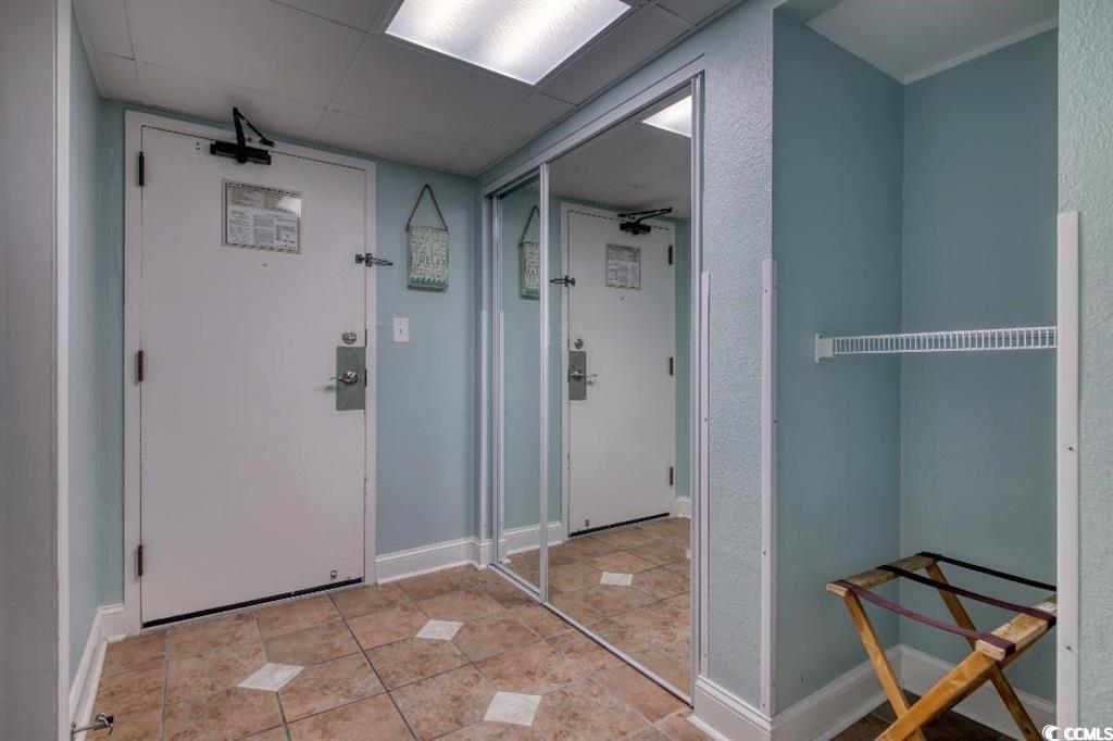 6900 North Ocean Boulevard, Unit 611 Myrtle Beach, SC 29572 - Photo 2 of 17 Interior space featuring light tile patterned floors and a drop ceiling