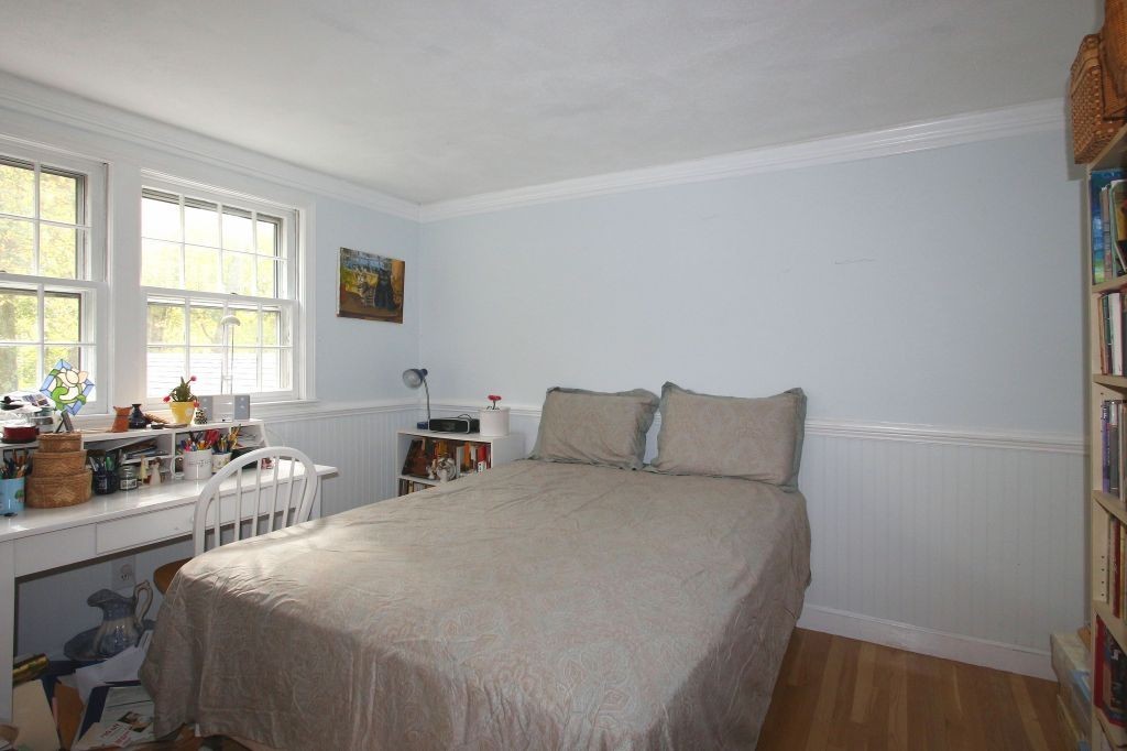 41 Campbell Road Wayland, MA 01778 - Photo 16 of 24 a bed room with a bed a table and a window