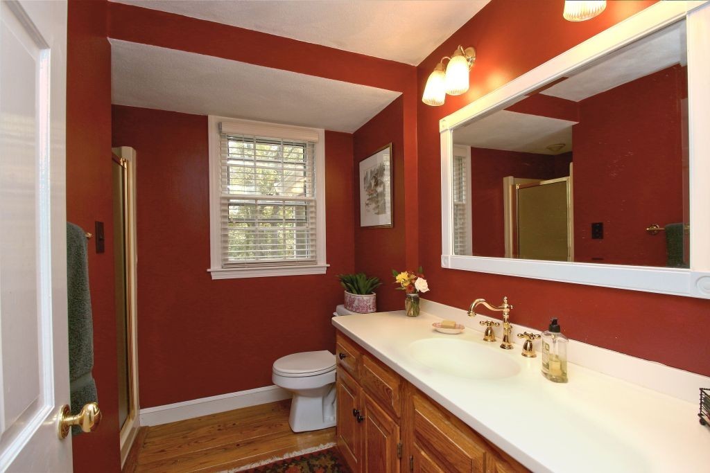 41 Campbell Road Wayland, MA 01778 - Photo 18 of 24 a bathroom with a sink toilet and mirror
