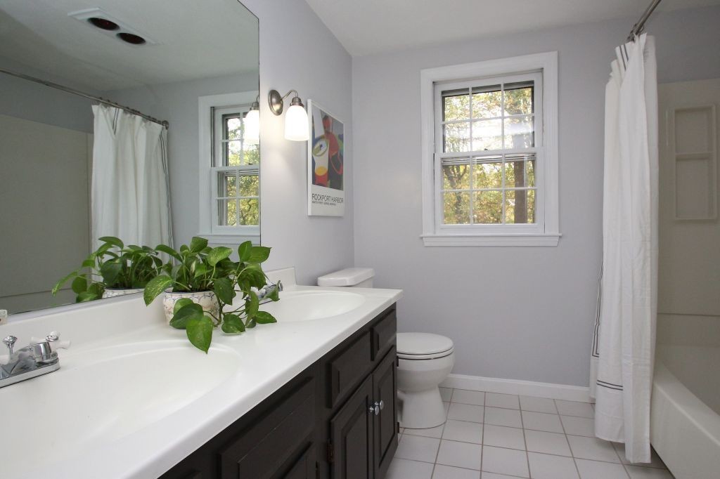 41 Campbell Road Wayland, MA 01778 - Photo 19 of 24 a bathroom with a sink a toilet and a mirror