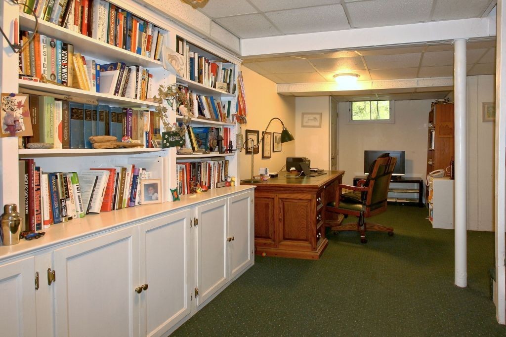 41 Campbell Road Wayland, MA 01778 - Photo 21 of 24 a workspace with a bookshelf and a workspace