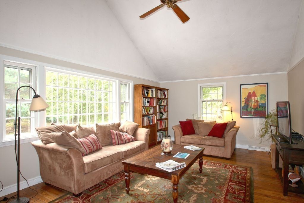 41 Campbell Road Wayland, MA 01778 - Photo 7 of 24 a living room with furniture a flat screen tv and a large window