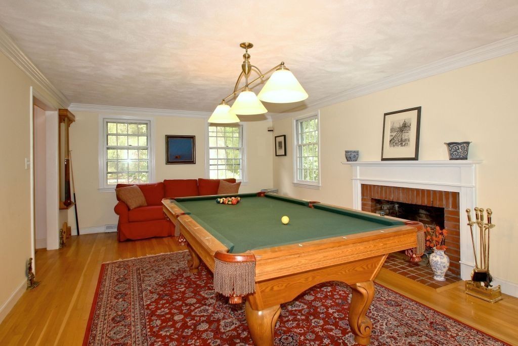 41 Campbell Road Wayland, MA 01778 - Photo 8 of 24 a room with furniture and a fireplace