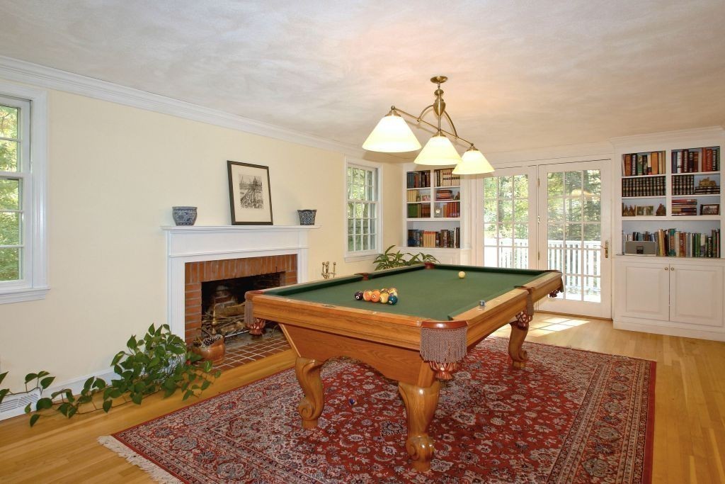 41 Campbell Road Wayland, MA 01778 - Photo 9 of 24 a living room with furniture pool table and a fireplace