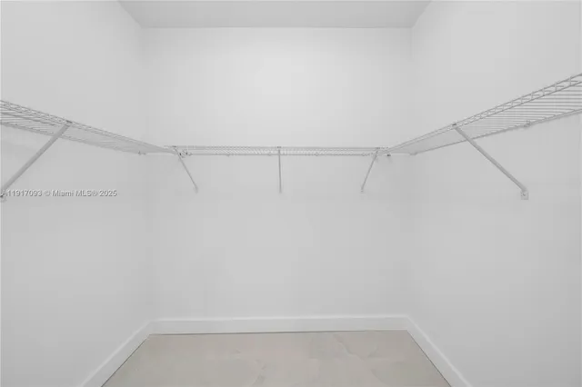 a bathroom with a granite countertop sink a toilet a mirror and shower