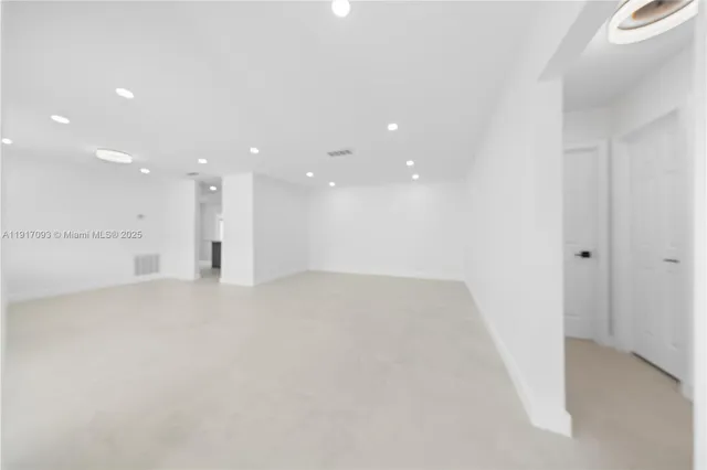 a view of a back yard from a corridor