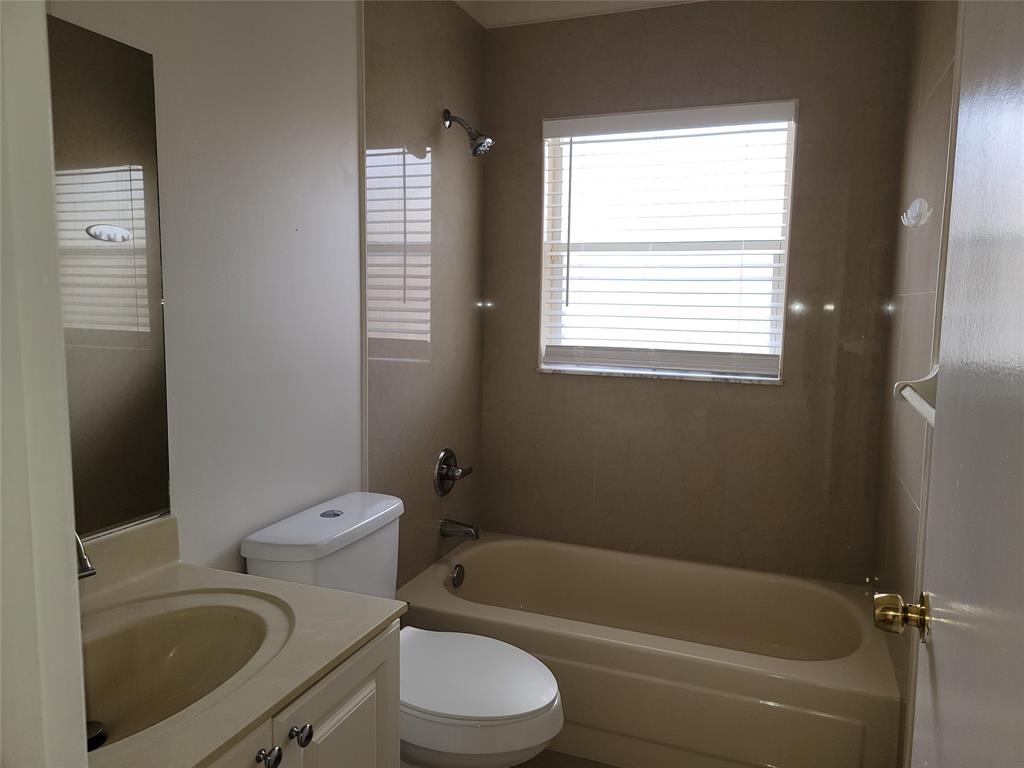 12255 Royal Palm Boulevard, Unit 8O Coral Springs, FL 33065 - Photo 15 of 15 a bathroom with a sink toilet and bathtub