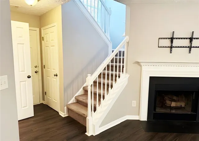 a view of an entryway with wooden floor
