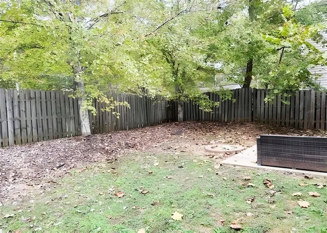a backyard of a house with lots of green space