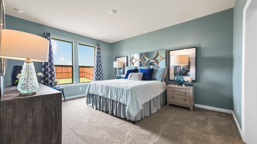 244 Kinley Street Grandview, TX 76050 - Photo 10 of 32 a bed room with a bed and a window