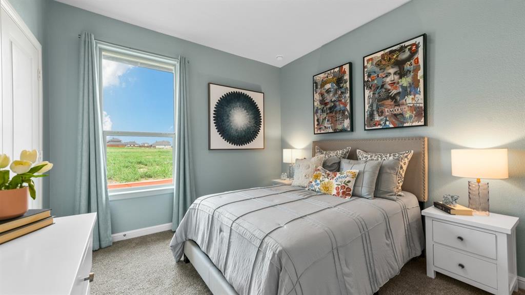 244 Kinley Street Grandview, TX 76050 - Photo 17 of 32 a bedroom with bed and window