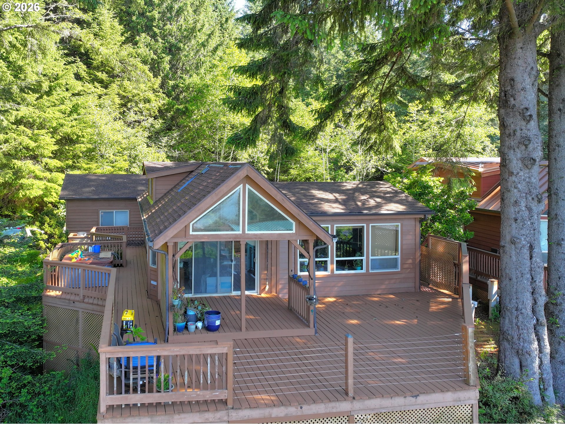 19921 Whaleshead Road, Unit U25 Brookings, OR 97415 - Photo 5 of 47 a view of a house with a garden