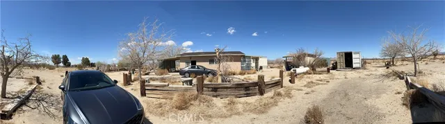 a view of living room with furniture and a chandelier