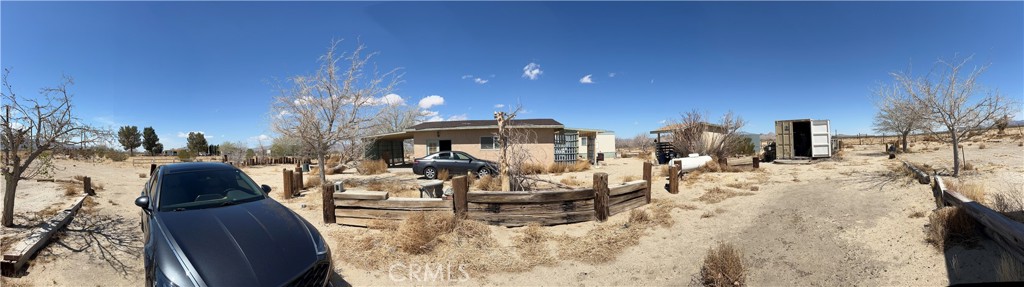a view of living room with furniture and a chandelier