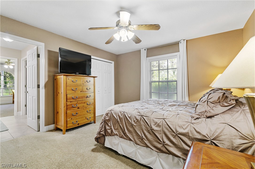 17571 Oak Creek Road Alva, FL 33920 - Photo 22 of 49 a bedroom with a bed and a television