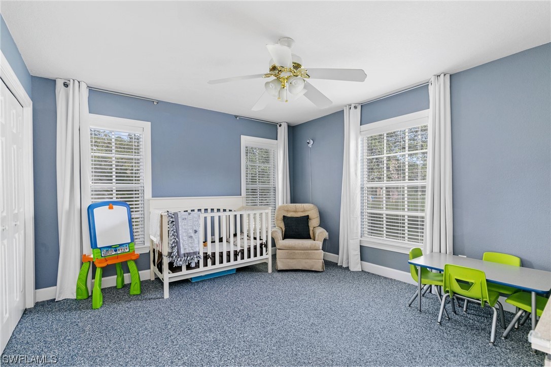 17571 Oak Creek Road Alva, FL 33920 - Photo 25 of 49 a living room with furniture and a window