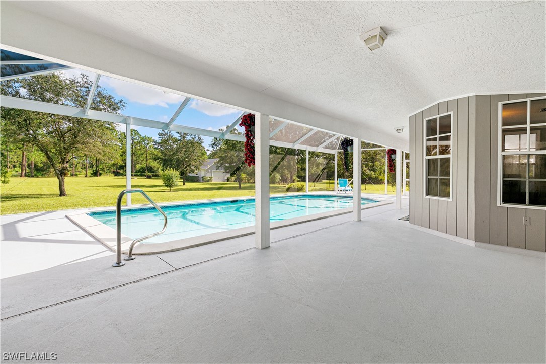 17571 Oak Creek Road Alva, FL 33920 - Photo 28 of 49 a view of an empty room with floor to ceiling windows