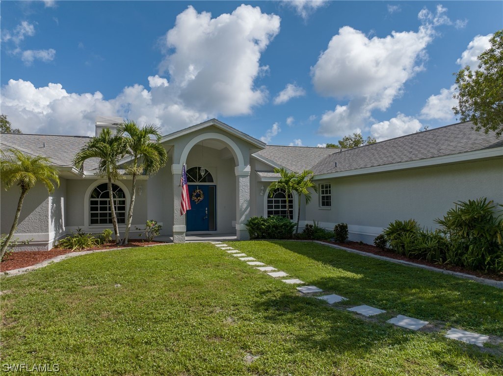 17571 Oak Creek Road Alva, FL 33920 - Photo 3 of 49 a view of a house with a big yard