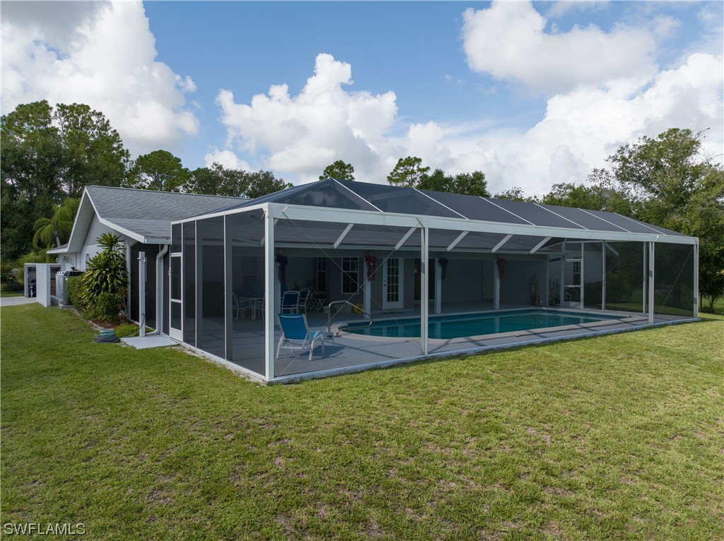 17571 Oak Creek Road Alva, FL 33920 - Photo 34 of 49 a view of a house with a yard and sitting area