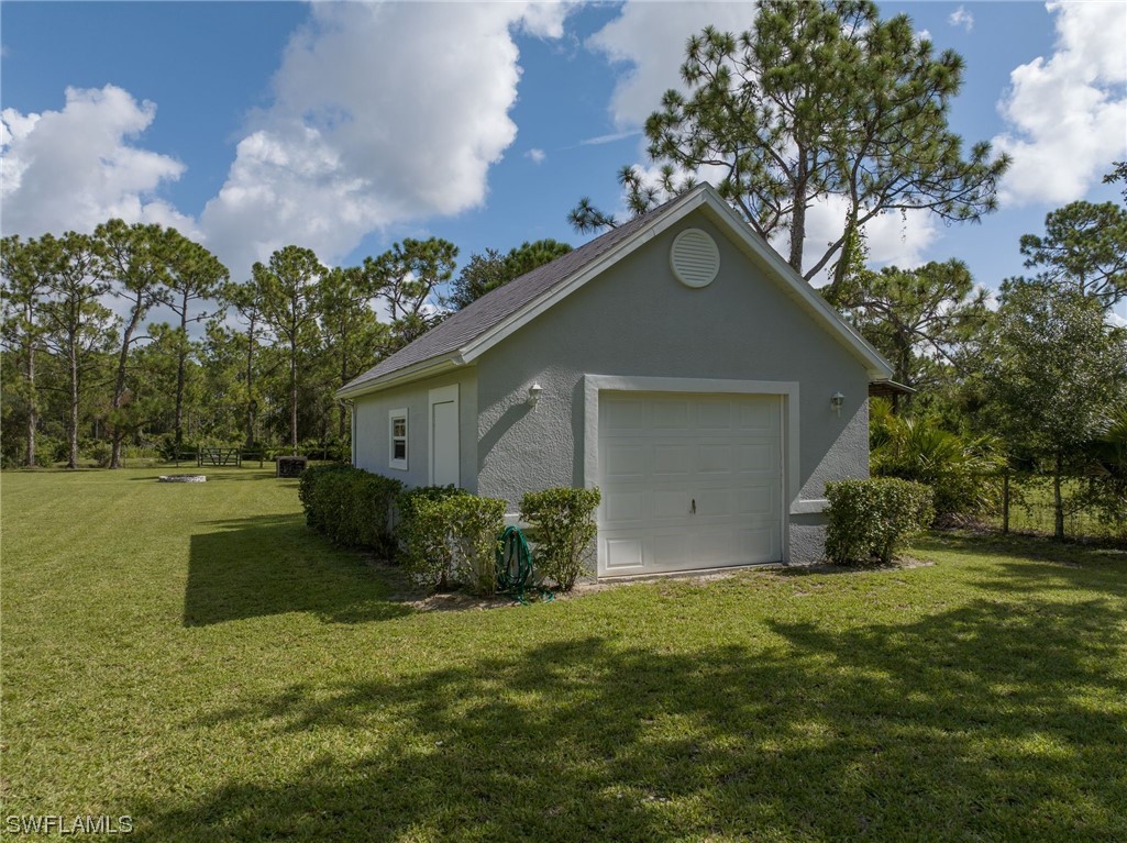 17571 Oak Creek Road Alva, FL 33920 - Photo 38 of 49 a view of a house with backyard