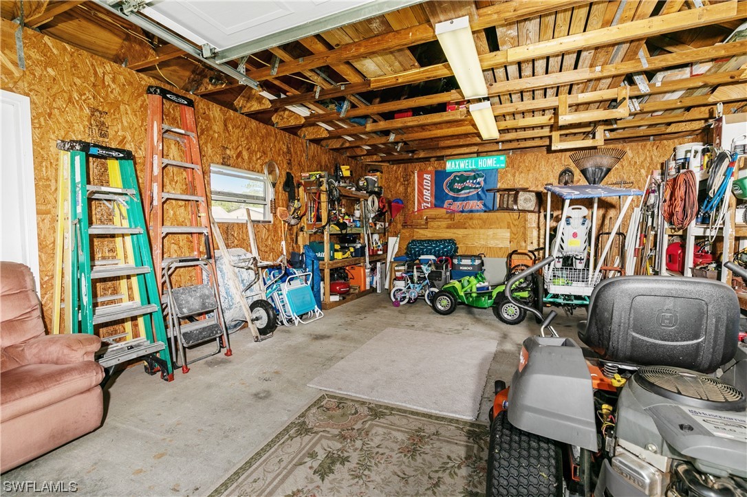 17571 Oak Creek Road Alva, FL 33920 - Photo 39 of 49 a view of a storage room with a lot of stuff