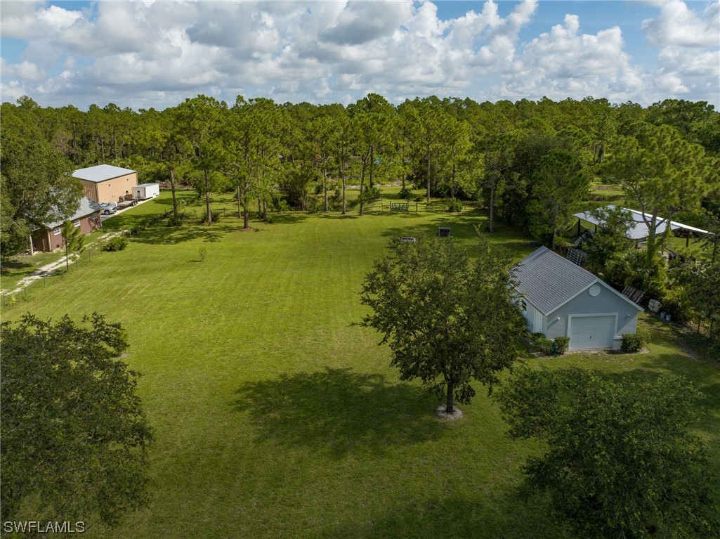 17571 Oak Creek Road Alva, FL 33920 - Photo 44 of 49 a view of a lake with a yard