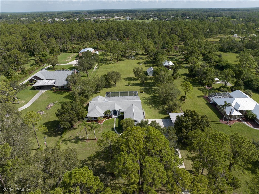 17571 Oak Creek Road Alva, FL 33920 - Photo 48 of 49 an aerial view of residential house with outdoor space