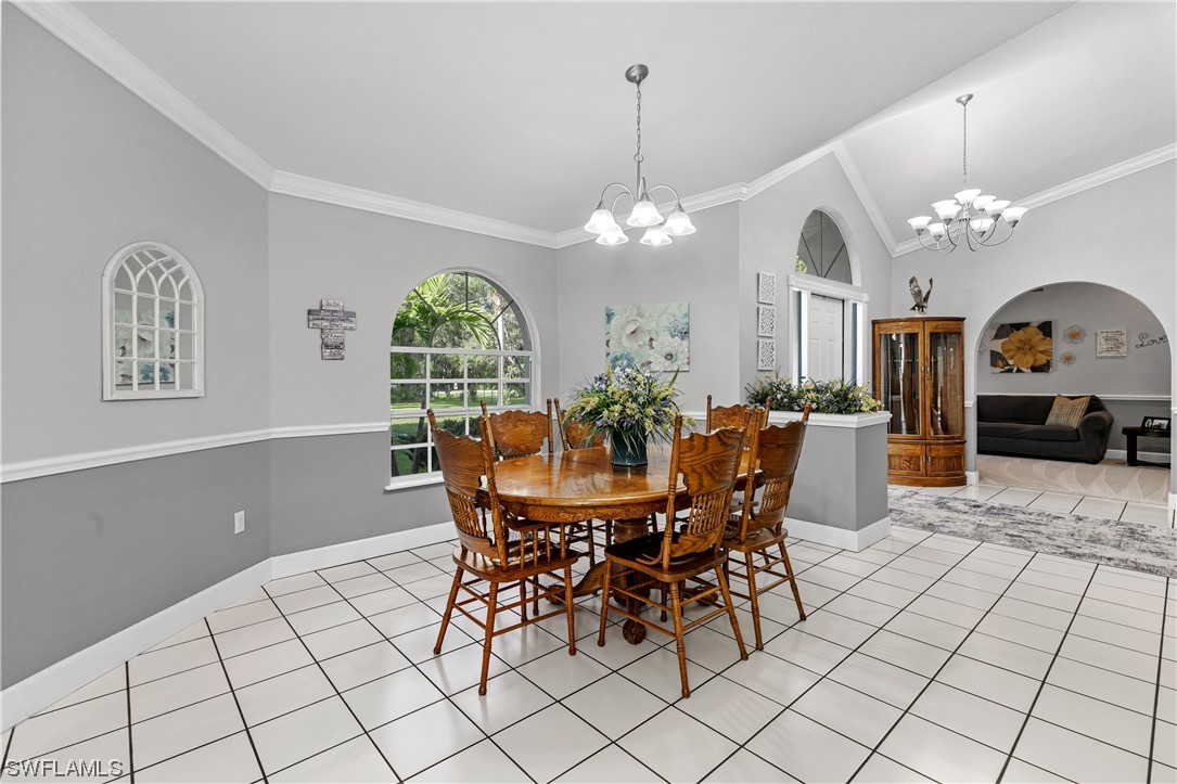 17571 Oak Creek Road Alva, FL 33920 - Photo 10 of 49 a view of a dining room with furniture window and chandelier