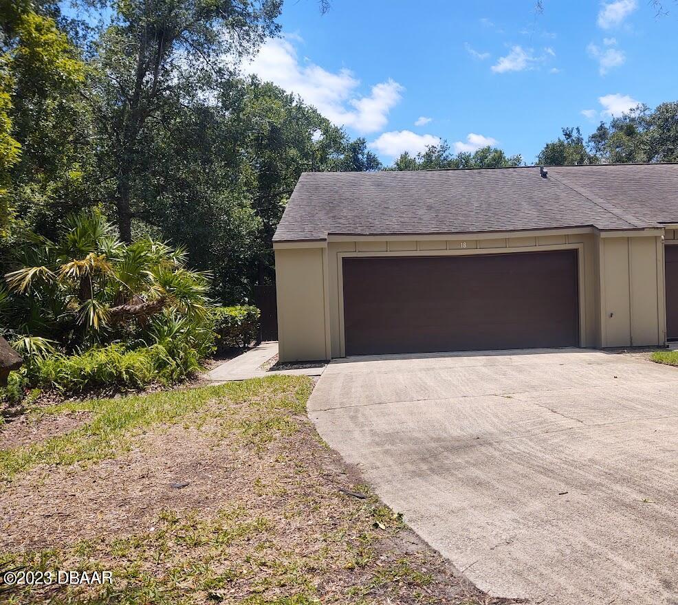 18 Maplewood Trail Ormond Beach, FL 32174 - Photo 3 of 20 Front Yard and Garage