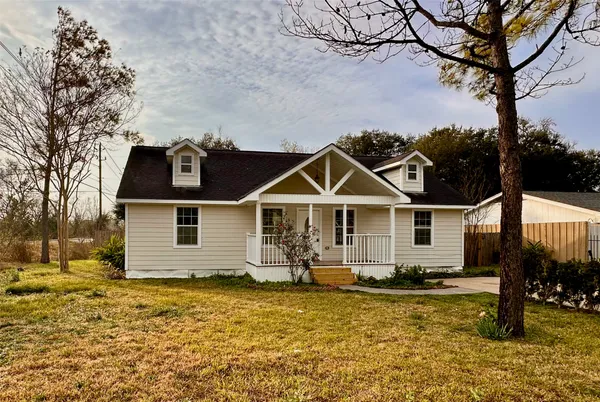 a front view of a house with yard