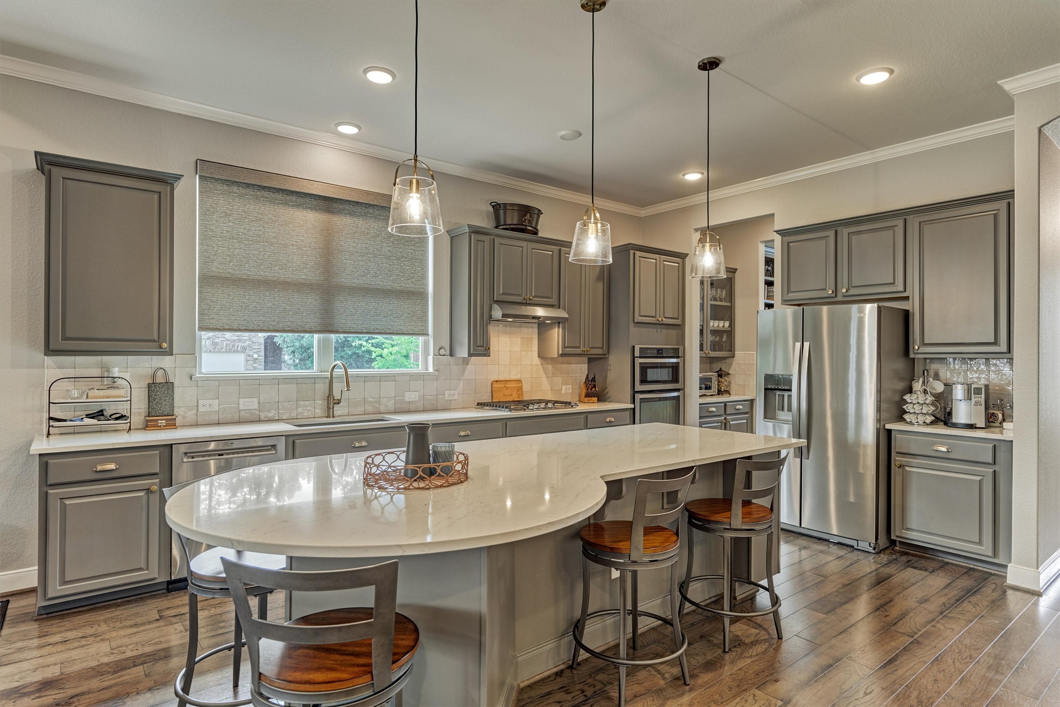 108 Wild Wick Way Spring, TX 77382 - Photo 13 of 44 The Delightful Kitchen Features A Spacious Breakfast Bar, Stainless Steel Appliances (Refrigerator Stays), Great Storage, And Attactive Pendant Lighting; The Under-Cabinets Also Offer Pull Out Shelving That Increases The Storage Capacity!