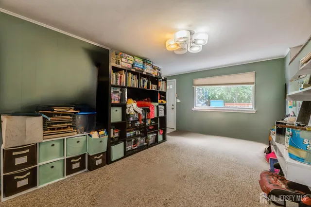 a room with furniture and a flat screen tv