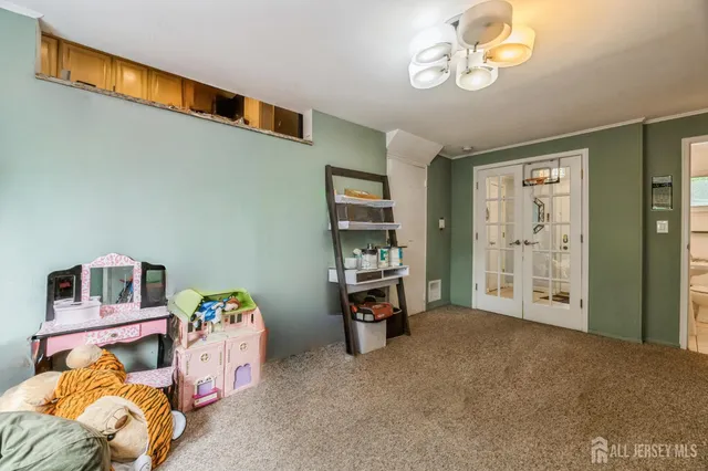 a bedroom with furniture and a window
