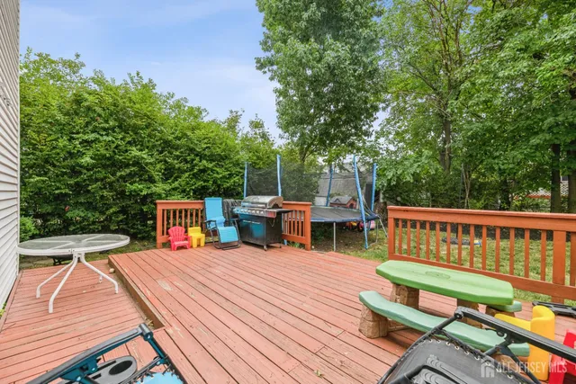 a view of a deck with wooden floor and seating space